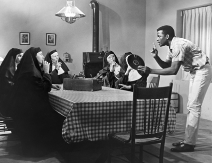 Sidney Poitier speaking to a group of nuns in a scene from Lilies of the Field