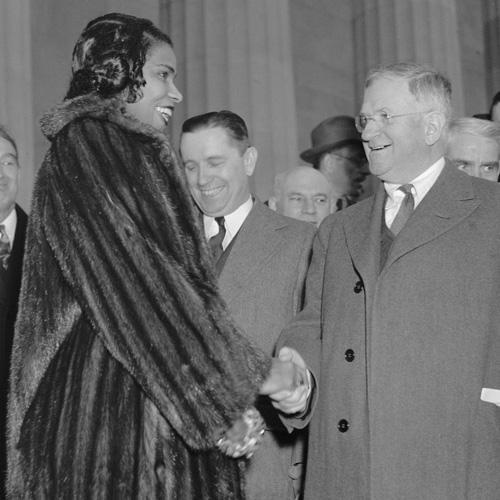Singer Marian Anderson being congratulated by Interior Secretary Ickes at a concert in Washington, D.C., April 9, 1939